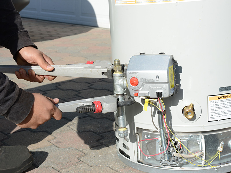 Close-up of Technician's Hands Working on a Water Heater, San Jose, CA