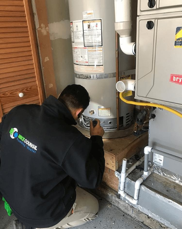 Worker Repairing Water Heater
