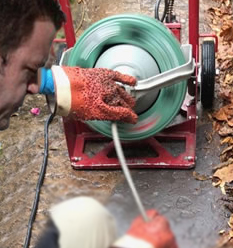 Technician doing a drain cleaning service