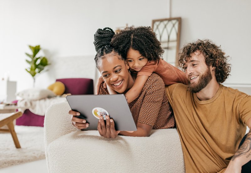 Parents enjoying movie with daughter