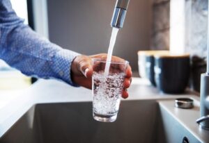 Man Pouring Himself Water