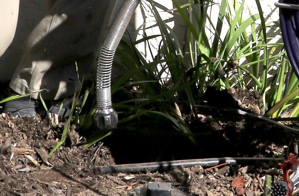 Technician performing sewer video camera assessment