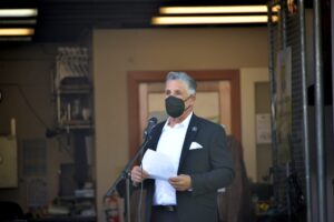 The owner of Mike Counsil Plumbing and Rooter is giving a speech at an event in San Jose, CA.