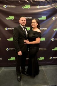 A festive couple at a Mike Counsil Plumbing and Rooter Christmas party