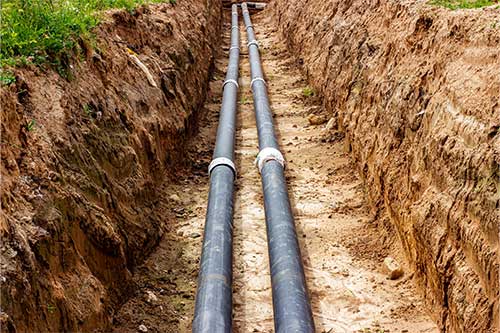 Technician Performing Pipe Maintenance in a Residential Area, San Jose, CA