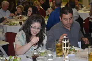 Mike Counsil Plumbing and Rooter employees eating at an event