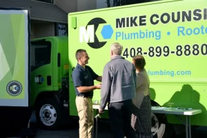 Mike Counsil Plumbing and Rooter employees shaking hands